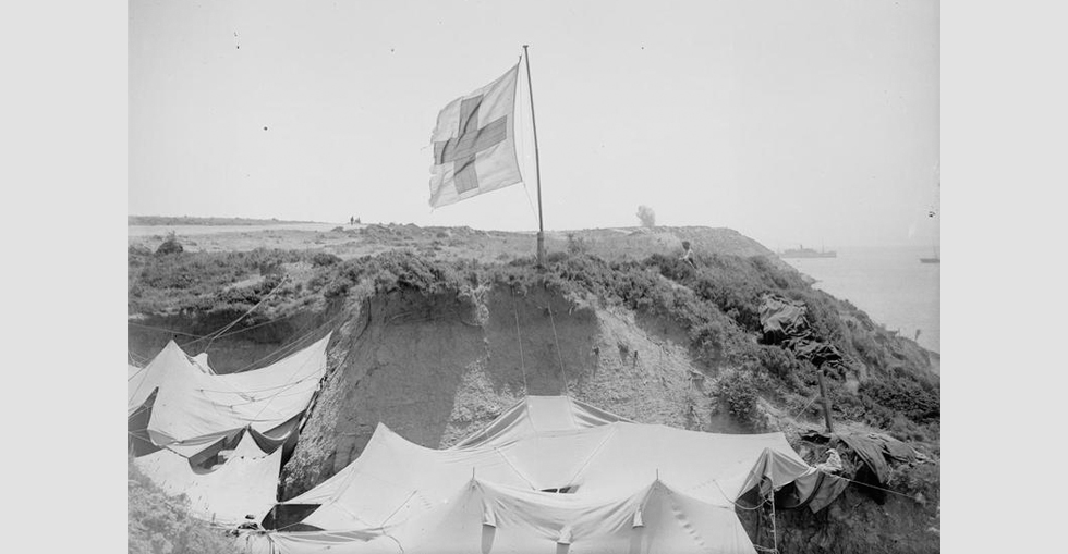 An advanced dressing station in the shelter of a rocky cliff at Gurkha Bluff 'Y' Ravine manned by 42nd Division