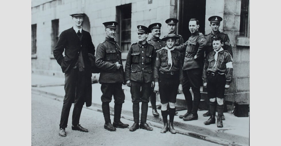 Soldiers with a boy scout