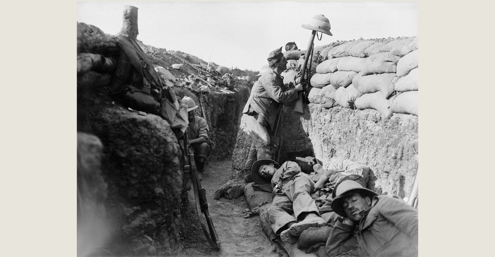 A Royal Irish Fusilier at Gallipoli in 1915, attempts to draw the fire of a Turkish sniper to reveal his position.